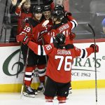 
              New Jersey Devils left wing Janne Kuokkanen (59) celebrates his goal with teammates during the third period of an NHL hockey game against the Edmonton Oilers Friday, Dec. 31, 2021, in Newark, N.J. (AP Photo/Bill Kostroun)
            