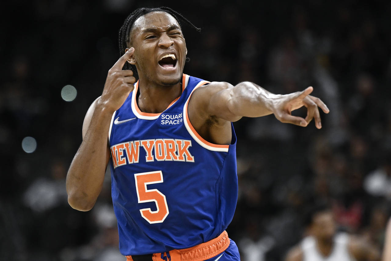 New York Knicks' Immanuel Quickley celebrates a basket during the second half of the team's NBA bas...