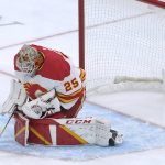 Calgary Flames goaltender Jacob Markstrom makes a stop against the Seattle Kraken during the first period of an NHL hockey game Thursday, Dec. 30, 2021, in Seattle. (AP Photo/Ted S. Warren)