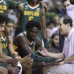 
              Baylor head coach Scott Drew, right, talks with his team during a timeout in the second half of an NCAA college basketball game against Alcorn State, Monday, Dec. 20, 2021, in Waco, Texas. (AP Photo/Rod Aydelotte)
            