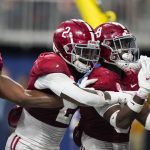 
              Alabama defensive back Jordan Battle (9) celebrates his interception and touchdown against Georgia during the second half of the Southeastern Conference championship NCAA college football game, Saturday, Dec. 4, 2021, in Atlanta. (AP Photo/Brynn Anderson)
            