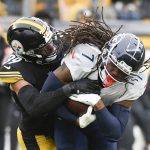 
              Pittsburgh Steelers free safety Minkah Fitzpatrick (39) tackles Tennessee Titans running back D'Onta Foreman (7) during the first half of an NFL football game, Sunday, Dec. 19, 2021, in Pittsburgh. (AP Photo/Don Wright)
            