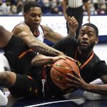 
              Connecticut's Jordan Hawkins, back, pressures Grambling State's Terreon Randolph in the second half of an NCAA college basketball game, Saturday, Dec. 4, 2021, in Storrs, Conn. (AP Photo/Jessica Hill)
            