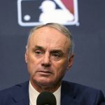 
              Major League Baseball commissioner Rob Manfred speaks during a news conference in Arlington, Texas, Thursday, Dec. 2, 2021. Owners locked out players at 12:01 a.m. Thursday following the expiration of the sport's five-year collective bargaining agreement. (AP Photo/LM Otero)
            