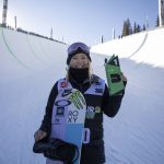 
              Chloe Kim, of the United States, holds the first place finish following the snowboarding halfpipe finals, Sunday, Dec. 19, 2021, during Dew Tour at Copper Mountain, Colo. (AP Photo/Hugh Carey)
            