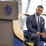 
              Marcus Freeman listens during a news conference Monday, Dec. 6, 2021 at the Irish Athletic Center in South Bend, Ind. Notre Dame formally introduced Freeman as its new football coach, a meteoric rise for the defensive coordinator. (Michael Caterina/South Bend Tribune via AP)
            