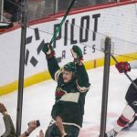 
              Minnesota Wild left wing Kirill Kaprizov (97) celebrates a goal as New Jersey Devils center Michael McLeod (20) skates away during the first period of an NHL hockey game, Thursday, Dec. 2, 2021, in St. Paul, Minn. (AP Photo/Andy Clayton-King)
            