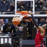 
              Nicholls State guard Latrell Jones dunks during the second half of the team's NCAA college basketball game against Purdue, Wednesday, Dec. 29, 2021, in West Lafayette, Ind. (AP Photo/Doug McSchooler)
            