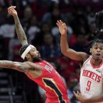 
              New Orleans Pelicans forward Brandon Ingram, left, loses the ball under pressure from Houston Rockets guard Josh Christopher (9) during the first half of an NBA basketball game, Sunday, Dec. 5, 2021, in Houston. (AP Photo/Michael Wyke)
            