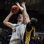 
              Purdue center Zach Edey (15) shoots over Iowa forward Filip Rebraca (0) during the second half of an NCAA college basketball game in West Lafayette, Ind., Friday, Dec. 3, 2021. (AP Photo/Michael Conroy)
            