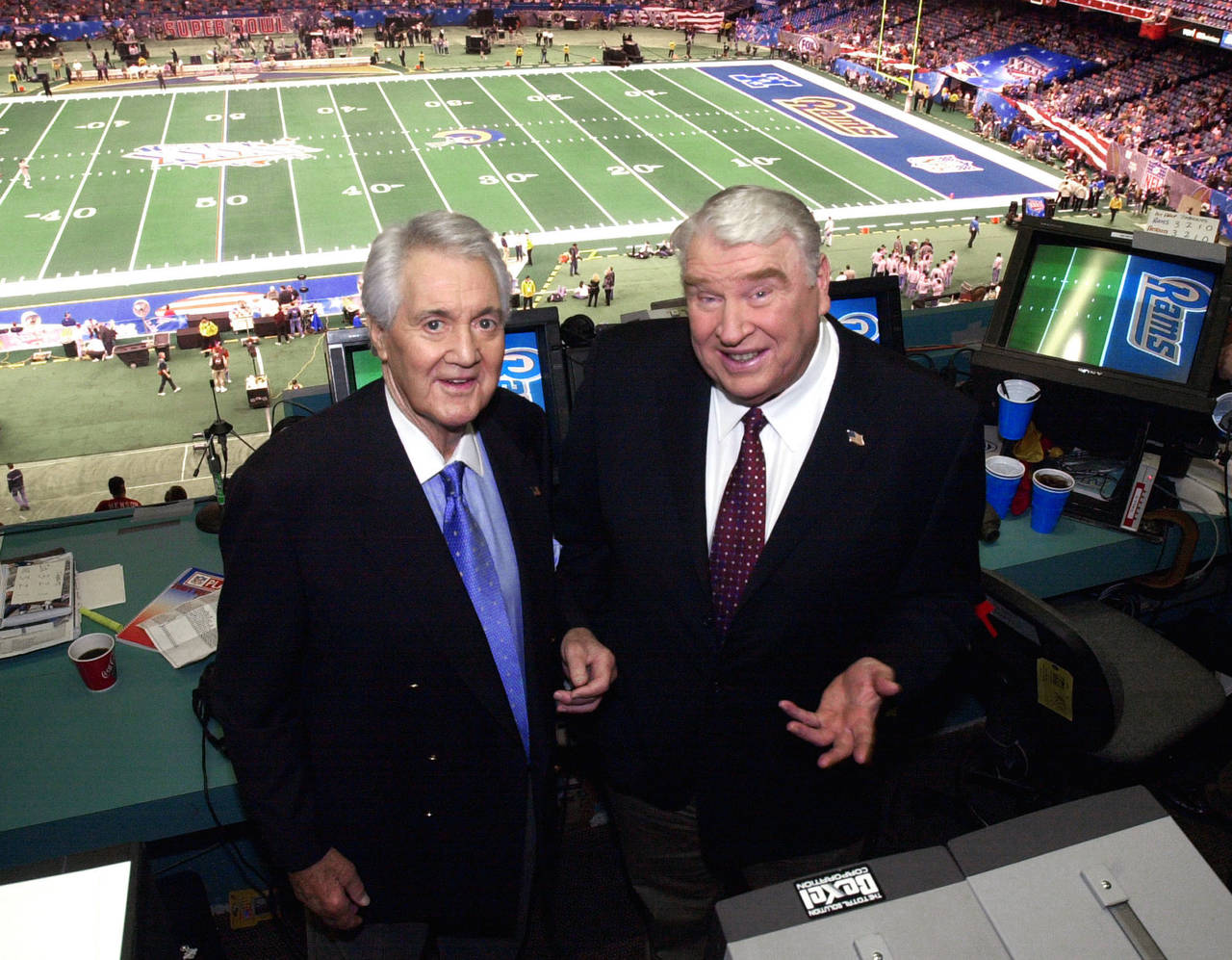 FILE - Fox broadcasters Pat Summerall, left, and John Madden stand in the broadcast booth at the Su...