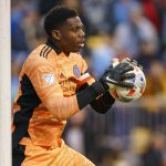 
              New York City FC's Sean Johnson makes a save during the first half of an MLS playoff soccer match against the Philadelphia Union, Sunday, Dec. 5, 2021, in Chester, Pa. (AP Photo/Chris Szagola)
            