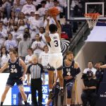 
              BYU guard Te'Jon Lucas (3) shoots against Utah State in the first half during an NCAA college basketball game Wednesday, Dec. 8, 2021, in Provo, Utah. (AP Photo/Rick Bowmer)
            