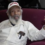 
              James Meredith, who integrated the University of Mississippi as its first Black student in 1962, reflects on his efforts to dismantle white supremacy and his mission to promote religious revival, at his home in Jackson, Miss., Thursday, Oct. 28, 2021.  A person close to Meredith is selling “New Miss” merchandise and trying to trademark a logo with cursive script that is nearly identical to the university's Ole Miss logo. The university is fighting the trademark effort.  (AP Photo/Rogelio V. Solis)
            