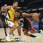 
              Miami Heat guard Kyle Lowry, right, drives around Indiana Pacers guard Malcolm Brogdon during the first half of an NBA basketball game in Indianapolis, Friday, Dec. 3, 2021. (AP Photo/AJ Mast)
            