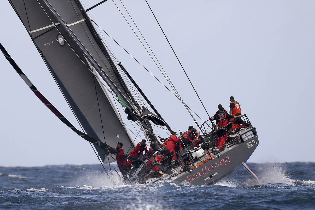 Scallywag leads the field after the start of the 76th annual Sydney Hobart yacht race in Sydney, Su...