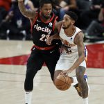 
              Phoenix Suns guard Cameron Payne, right, drives the ball down court against Portland Trail Blazers guard Ben McLemore, left, during the first half of an NBA basketball game in Portland, Ore., Tuesday, Dec. 14, 2021. (AP Photo/Steve Dipaola)
            