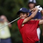 
              Charlie Woods, son of Tiger Woods,  watches his shot on the first tee during the second round of the PNC Championship golf tournament Sunday, Dec. 19, 2021, in Orlando, Fla. (AP Photo/Scott Audette)
            