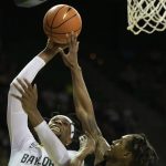 
              Baylor forward Flo Thamba (0) attempts a shot over Arkansas-Pine Bluff guard Kylen Milton (1) in the first half of an NCAA college basketball game in Waco, Texas, Saturday, Dec. 4, 2021. (AP Photo/Emil Lippe)
            