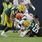 
              Green Bay Packers' Rashan Gary sacks Cleveland Browns' Baker Mayfield during the second half of an NFL football game Saturday, Dec. 25, 2021, in Green Bay, Wis. (AP Photo/Aaron Gash)
            