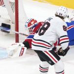 
              Montreal Canadiens goaltender Jake Allen dives back to the net to make a save against Chicago Blackhawks' Patrick Kane (88) during first-period NHL hockey game action in Montreal, Thursday, Dec. 9, 2021. (Paul Chiasson/The Canadian Press via AP)
            
