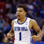 
              Seton Hall's guard Bryce Aiken (1) celebrates a point against Rutgers during the first half of an NCAA college basketball game at Prudential Center, Sunday, Dec. 12, 2021, in Newark, N.J. (AP Photo/Eduardo Munoz Alvarez)
            