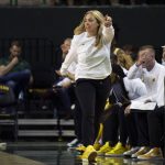 
              Baylor head coach Nicki Colleen points to the other side of the court after the ball goes out of bounds in the first half of an NCAA college basketball game against Missouri in Waco, Texas, Saturday, Dec. 4, 2021. (AP Photo/Emil Lippe)
            