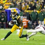 
              Green Bay Packers wide receiver Davante Adams runs after catching a pass while being defended by Chicago Bears linebacker Alec Ogeltree (44) during an NFL football game on Sunday, Dec. 12, 2021, in Green Bay, Wis. (Adam Niemi/The Daily Mining Gazette via AP)
            