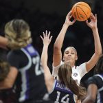 
              South Carolina center Kamilla Cardoso (10) passes the ball over Kansas State guard Rebekah Dallinger (14) during the second half of an NCAA college basketball game Friday, Dec. 3, 2021, in Columbia, S.C. (AP Photo/Sean Rayford)
            