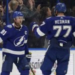 
              Tampa Bay Lightning center Steven Stamkos (91) celebrates his goal against the New York Rangers with defenseman Victor Hedman (77) during the first period of an NHL hockey game Friday, Dec. 31, 2021, in Tampa, Fla. (AP Photo/Chris O'Meara)
            