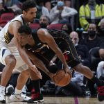 
              Miami Heat guard Kyle Lowry, right, drives to the basket past Indiana Pacers guard Malcolm Brogdon during the first half of an NBA basketball game, Tuesday, Dec. 21, 2021, in Miami. (AP Photo/Wilfredo Lee)
            