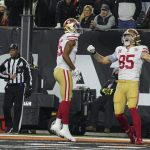 
              San Francisco 49ers' George Kittle (85) celebrates a touchdown reception with Jauan Jennings (15) during the first half of an NFL football game against the Cincinnati Bengals, Sunday, Dec. 12, 2021, in Cincinnati. (AP Photo/Jeff Dean)
            