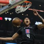 
              Los Angeles Clippers guard Brandon Boston Jr. (4) reacts after dunking the ball during the first half of an NBA basketball game against the Boston Celtics in Los Angeles, Wednesday, Dec. 8, 2021. (AP Photo/Ashley Landis)
            