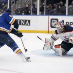 
              St. Louis Blues' Vladimir Tarasenko, left, scores past Edmonton Oilers goaltender Mike Smith during the second period of an NHL hockey game Wednesday, Dec. 29, 2021, in St. Louis. (AP Photo/Jeff Roberson)
            