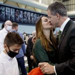 
              Mario Cristobal, right, kisses his wife, Jessica, after being introduced as Miami football coach during a news conference Tuesday, Dec. 7, 2021, in Coral Gables, Fla. Cristobal is returning to his alma mater, where he won two championships as a player. (AP Photo/Lynne Sladky)
            