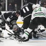 
              Los Angeles Kings goaltender Jonathan Quick (32) dives to make a save during the first period of an NHL hockey game against the Dallas Stars Thursday, Dec. 9, 2021, in Los Angeles. (AP Photo/Ashley Landis)
            