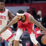 
              New Orleans Pelicans forward Brandon Ingram, right, looks to get around Houston Rockets forward Jae'Sean Tate (8) during the first half of an NBA basketball game Sunday, Dec. 5, 2021, in Houston. (AP Photo/Michael Wyke)
            
