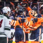 
              Edmonton Oilers' Connor McDavid (97) and Jesse Puljujarvi (13) celebrate a goal against the Minnesota Wild during during the second period of an NHL hockey game Tuesday, Dec. 7, 2021, in Edmonton, Alberta. (Jason Franson/The Canadian Press via AP)
            