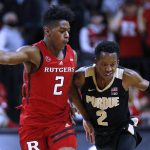 
              Purdue guard Eric Hunter Jr. (2) drives to the basket against Rutgers guard Jalen Miller (2) during the first half of an NCAA college basketball game in Piscataway, N.J., Thursday, Dec. 9, 2021. (AP Photo/Noah K. Murray)
            