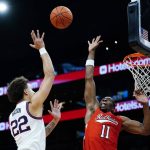 
              Gonzaga forward Anton Watson (22) shoots over Texas Tech forward Bryson Williams (11) during the first half of an NCAA college basketball game at the Jerry Colangelo Classic Saturday, Dec. 18, 2021, in Phoenix. (AP Photo/Ross D. Franklin)
            