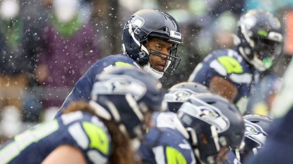 Seahawks QB Russell Wilson prepares for a snap in the first quarter Sunday against the Bears. (Phot...