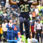 SEATTLE, WASHINGTON - JANUARY 02: Ryan Neal #26 of the Seattle Seahawks celebrates after hitting the arm of Tim Boyle #12 of the Detroit Lions to force a fourth down during the first quarter at Lumen Field on January 02, 2022 in Seattle, Washington. (Photo by Abbie Parr/Getty Images)
