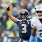 SEATTLE, WASHINGTON - JANUARY 02: Russell Wilson #3 of the Seattle Seahawks celebrates after a touchdown during the second quarter against the Detroit Lions at Lumen Field on January 02, 2022 in Seattle, Washington. (Photo by Steph Chambers/Getty Images)