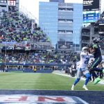 SEATTLE, WASHINGTON - JANUARY 02: DK Metcalf #14 of the Seattle Seahawks catches a pass for a touchdown during the third quarter against the Detroit Lions at Lumen Field on January 02, 2022 in Seattle, Washington. (Photo by Abbie Parr/Getty Images)