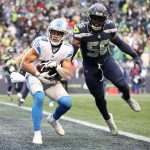 SEATTLE, WASHINGTON - JANUARY 02: Amon-Ra St. Brown #14 of the Detroit Lions catches the ball for a touchdown in the game against the Seattle Seahawks at Lumen Field on January 02, 2022 in Seattle, Washington. (Photo by Steph Chambers/Getty Images)