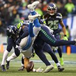SEATTLE, WASHINGTON - JANUARY 02: Trinity Benson #17 of the Detroit Lions is tackled during the fourth quarter against the Seattle Seahawks at Lumen Field on January 02, 2022 in Seattle, Washington. Benson was ruled down before the ball came out. (Photo by Abbie Parr/Getty Images)
