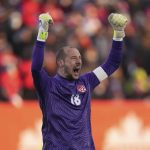 
              Canada keeper Milan Borjan reacts at the end of a World Cup soccer qualifier against the United States in Hamilton, Ontario, Sunday, Jan. 30, 2022. (Nathan Denette/The Canadian Press via AP)
            