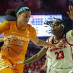 
              Tennessee Lady Vols guard Rae Burrell (12) drives past Georgia Lady Bulldogs guard Que Morrison (23) during the first half of an NCAA college basketball game Sunday, Jan. 23, 2022, in Athens, Ga. (AP Photo/Hakim Wright Sr.)
            