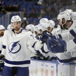 
              Tampa Bay Lightning center Anthony Cirelli (71) celebrates with teammates after scoring a goal during the first period of an NHL hockey game against the Buffalo Sabres on Tuesday, Jan. 11, 2022, in Buffalo, N.Y. (AP Photo/Joshua Bessex)
            