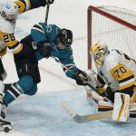 
              Pittsburgh Penguins defenseman Marcus Pettersson (28) and goaltender Louis Domingue, right, defend the goal against San Jose Sharks left wing Matt Nieto, middle, during the third period of an NHL hockey game in San Jose, Calif., Saturday, Jan. 15, 2022. (AP Photo/Jeff Chiu)
            